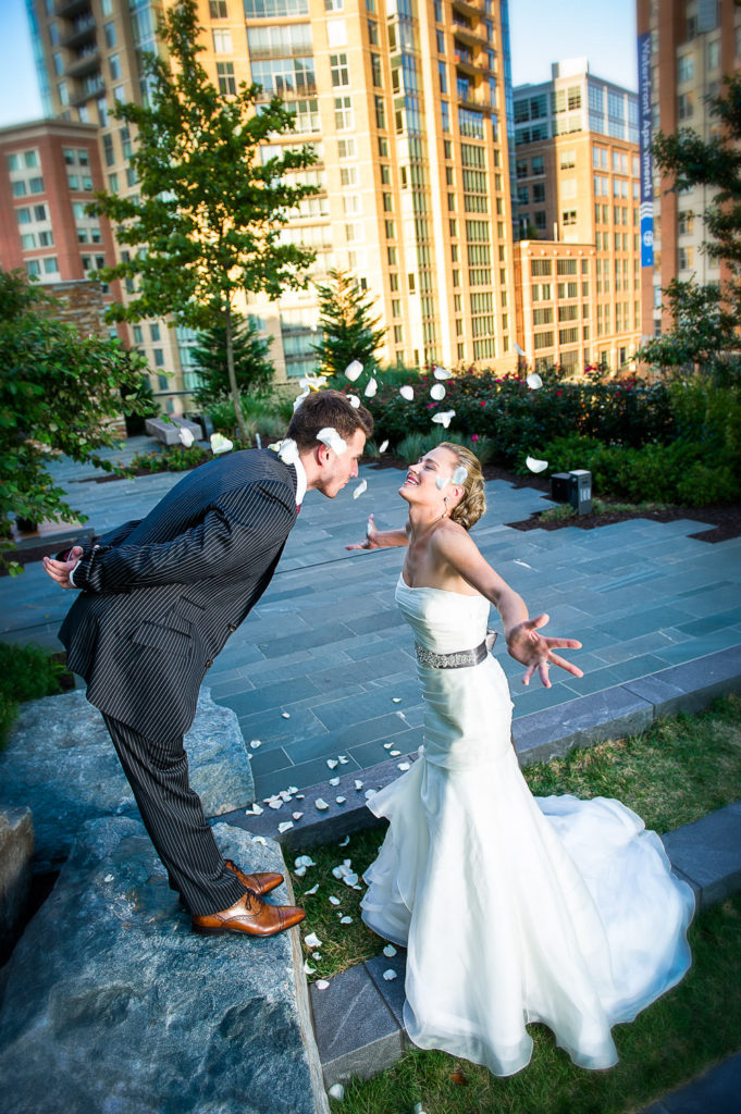 bride Heather showering Tim with flower petals at the Four Seasons Baltimore