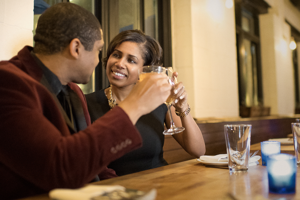 Ralph toasting with Lauren at Barcocina during their engagement session at the Baltimore Harbor